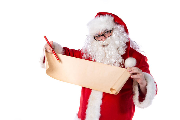 Funny Santa Claus with a list of gifts. - Foto, Bild