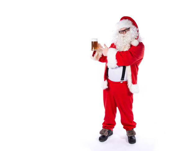 Funny santa claus drinks beer. - Foto, Imagen
