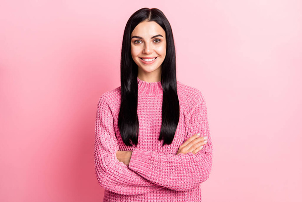 Photo of positive young girl folded arms beaming smile look camera wear sweater isolated on pink color background - Foto, imagen