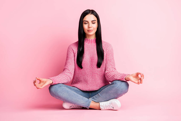 Full size photo of pretty person sit on floor closed eyes fingers meditate isolated on pink color background - Foto, Imagem
