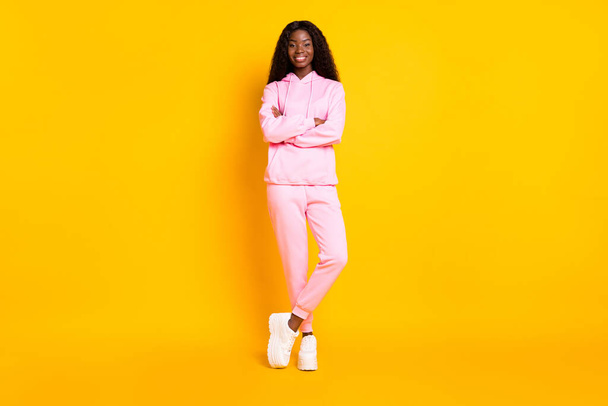 Photo portrait full body view of dark skin confident woman with crossed arms isolated on vivid yellow colored background - Φωτογραφία, εικόνα