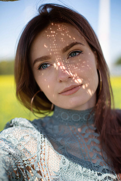 European white young woman with dark hair portrait with blue eyes - Zdjęcie, obraz