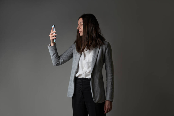 businesswoman dressed in a jacket and trousers in a casual style - Foto, afbeelding
