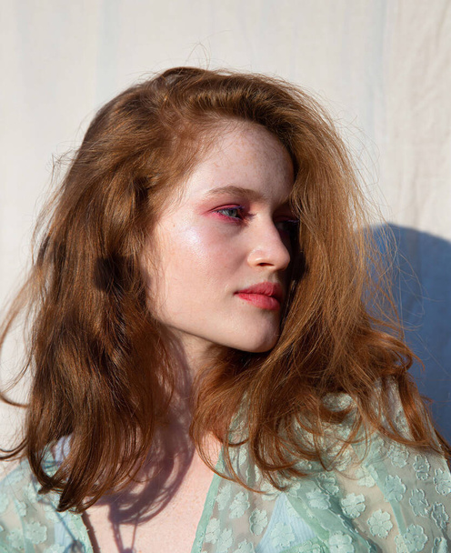 Young european white girl with dark hair portrait with shadow behind - Foto, Bild