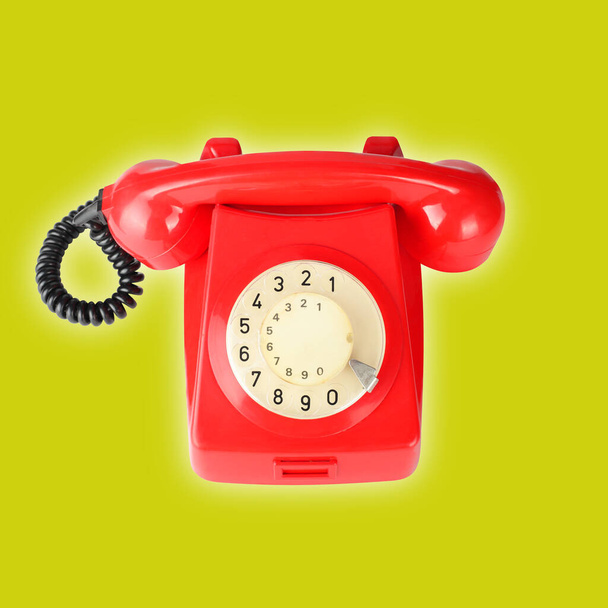 Top view Beautiful red vintage phone on a yellow background - Photo, Image