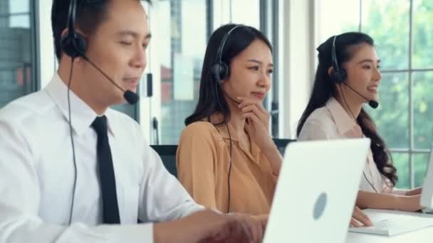 Business people wearing headset working actively in office - Footage, Video