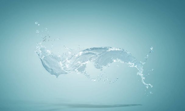 Water splash on blue background - Фото, изображение