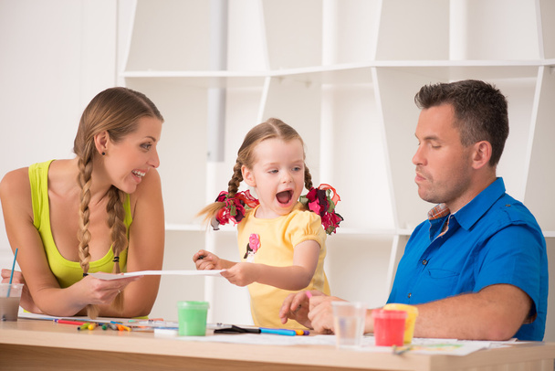 Lovely happy family drawing and painting at home together - Fotoğraf, Görsel