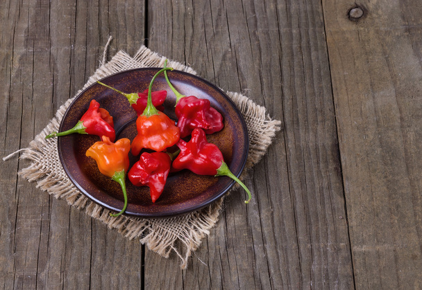 Exotic bell shaped capsicum over rustic wooden background - Photo, Image
