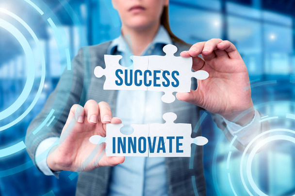 Sign displaying Success Innovate. Business showcase make organizations more adaptive to market forces Business Woman Holding Jigsaw Puzzle Piece Unlocking New Futuristic Tech. - Photo, Image