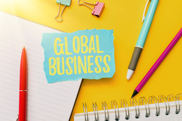 Pisanie tekstu Global Business. Word Written on Trade and business system a company doing across the world Flashy School And Office Supplies Bright Teaching And Learning Collections - Zdjęcie, obraz