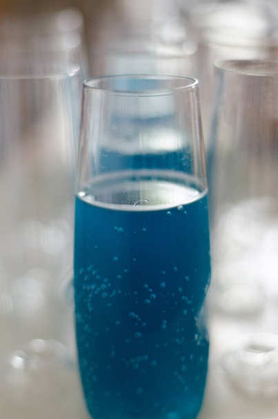 A closeup shot of a blue drink in the glass - Фото, зображення