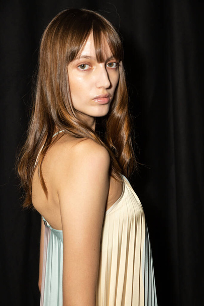 MILAN, ITALY - SEPTEMBER 24: Gorgeous model poses in the backstage just before Budapest Select show during Milan Women's Fashion Week on SEPTEMBER 24, 2021 in Milan - 写真・画像