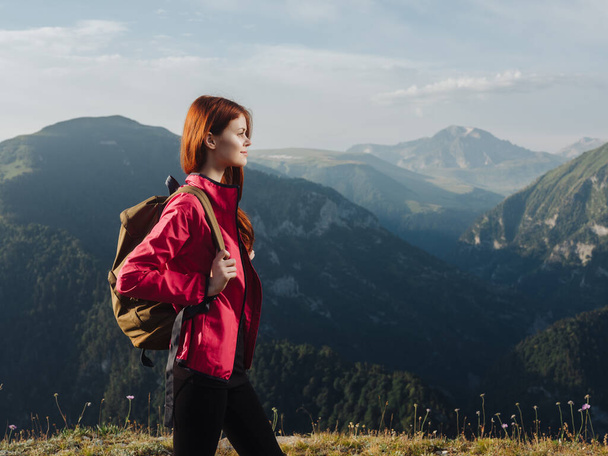 woman tourist with a backpack outdoors in the mountains fresh air - Фото, зображення