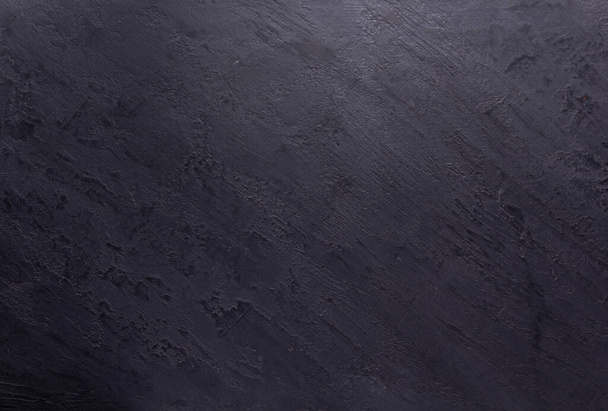 Black slate stone background texture. Putty or plaster wall surface - Фото, изображение