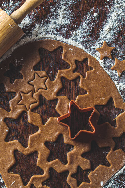 Christmas cooking concept. Raw dough for stars gingerbread cookies, top view. - Foto, immagini