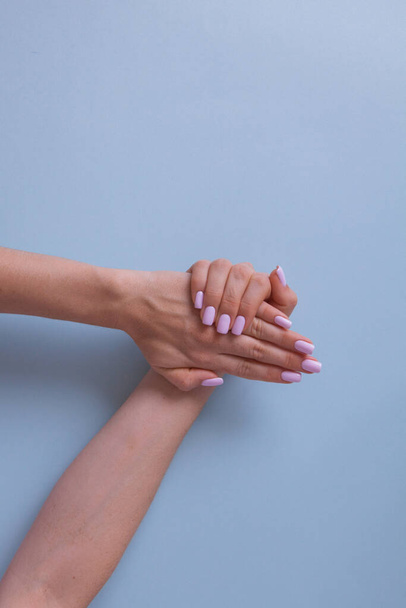 Pink manicure in beautiful style. Creative design. - Foto, afbeelding