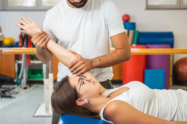 Physio treatment - elbow extension exercises - Фото, изображение