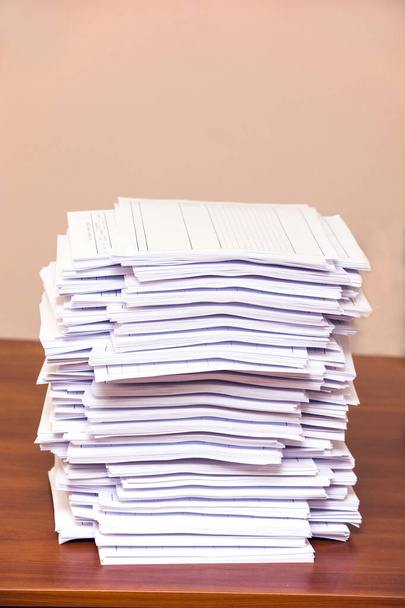 A stack of papers on desk - Fotoğraf, Görsel
