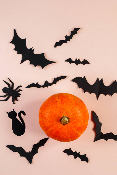 Happy Halloween. Bats and pumpkin on a pink pastel background. Place for text. - Foto, Imagem