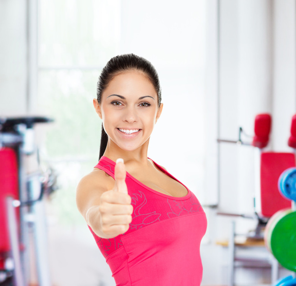 Fitness woman shows thumb up - Φωτογραφία, εικόνα