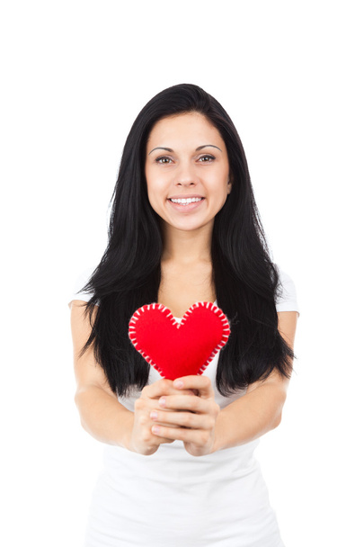 Attractive brunette girl holding heart - Zdjęcie, obraz