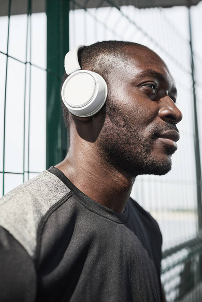 Man in wireless headphones at training - Photo, image