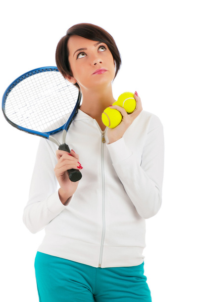 jong meisje met tennis racket en bal geïsoleerd op wit - Foto, afbeelding