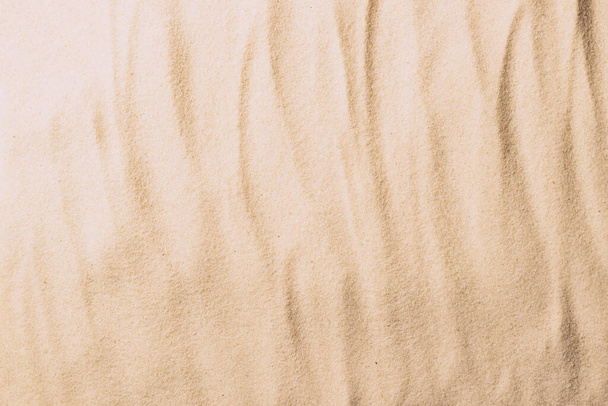Abstract sand texture. Natural sandy background for product presentation. Top view frame - Foto, afbeelding