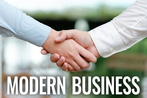 Text showing inspiration Modern Business. Business concept Introduction to the philosophy of large corporate enterprise Two Professional Well-Dressed Corporate Businessmen Handshake Indoors - Photo, Image
