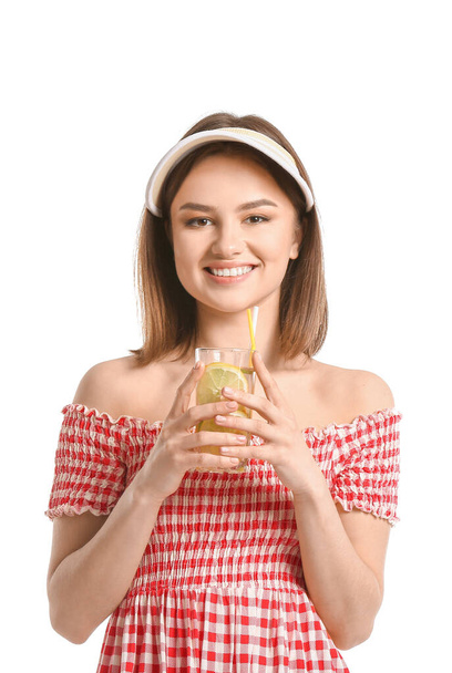 Beautiful young woman with fresh lemonade on white background - Photo, image