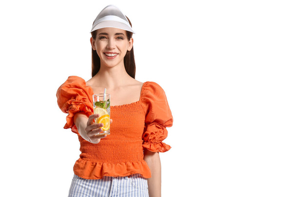 Beautiful young woman with fresh lemonade on white background - Photo, Image