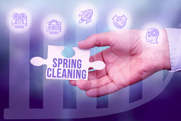 Writing displaying text Spring Cleaning. Concept meaning practice of thoroughly cleaning house in the springtime Hand Holding Jigsaw Puzzle Piece Unlocking New Futuristic Technologies. - Photo, Image