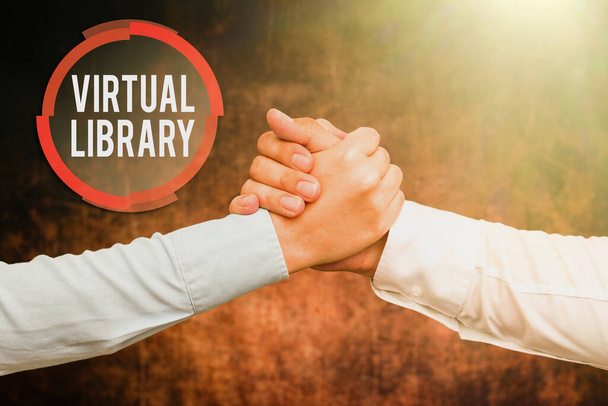 Text sign showing Virtual Library. Conceptual photo collection of resources available on computer systems Two Professional Well-Dressed Corporate Businessmen Handshake Indoors - Photo, Image