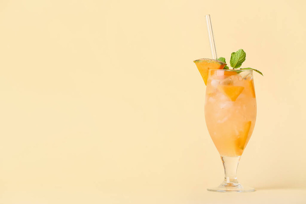 Glass of cold melon cocktail with mint on color background - Zdjęcie, obraz
