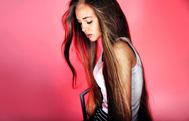 Young girl with long hair posing - Fotografie, Obrázek