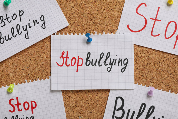 Notes with phrase Stop Bullying pinned to cork board, closeup - Zdjęcie, obraz