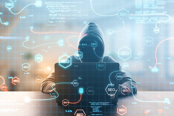 Hacker at desktop using abstract interface with glowing SEO hologram and icons on blurry background. Search engine optimization, hacking and coding concept. Double exposure - Fotoğraf, Görsel