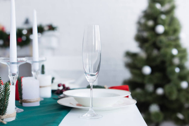 selective focus of champagne glass on table served for christmas dinner - Foto, Imagem