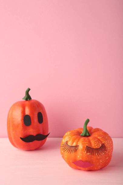 Halloween pumpkin with make up. Minimal Holiday season concept background. top view - Φωτογραφία, εικόνα