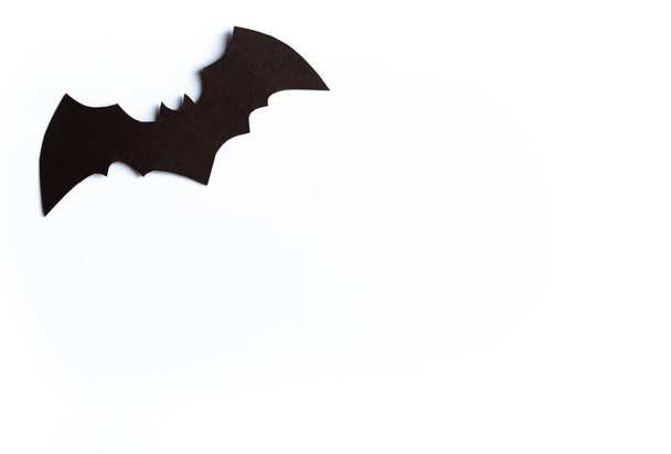 Halloween concept, black bat on white background, handmade atmospheric halloween background, flay, copy space, cut out - Fotó, kép