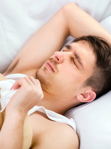 Young Man sleep in the Bed at the Home - Photo, Image