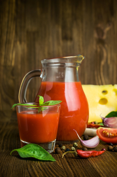 tomato juice with cheese, basil and spices - Foto, imagen