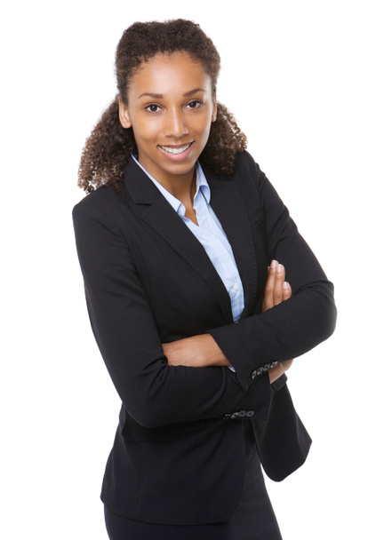 Young business woman smiling with arms crossed - 写真・画像