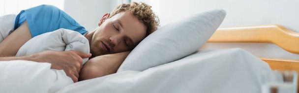 curly patient sleeping in hospital bed, banner - Valokuva, kuva