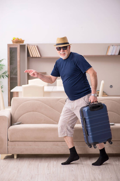 Old man preparing for trip at home - Photo, Image