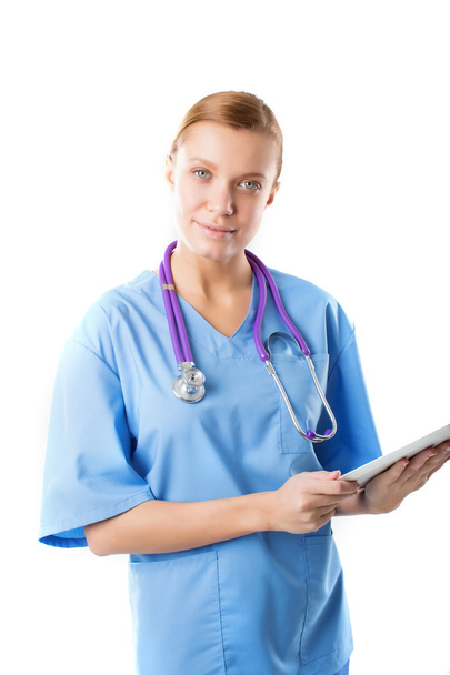 beautiful young female medical intern with tablet computer - Foto, afbeelding