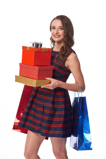 Young Woman Buying Christmas Presents - 写真・画像