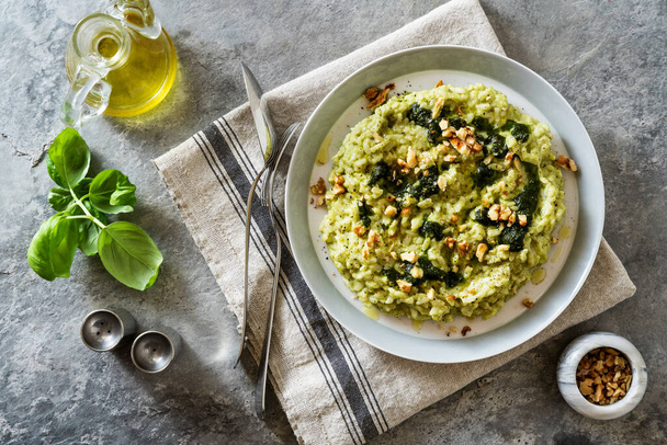 Vegan green risotto with zucchini cream and walnuts - Zdjęcie, obraz