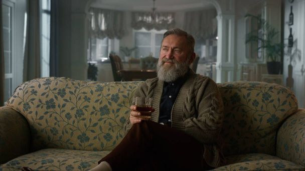 Rich senior man enjoy retirement life cognac. Confident old gentleman drinking - Photo, Image